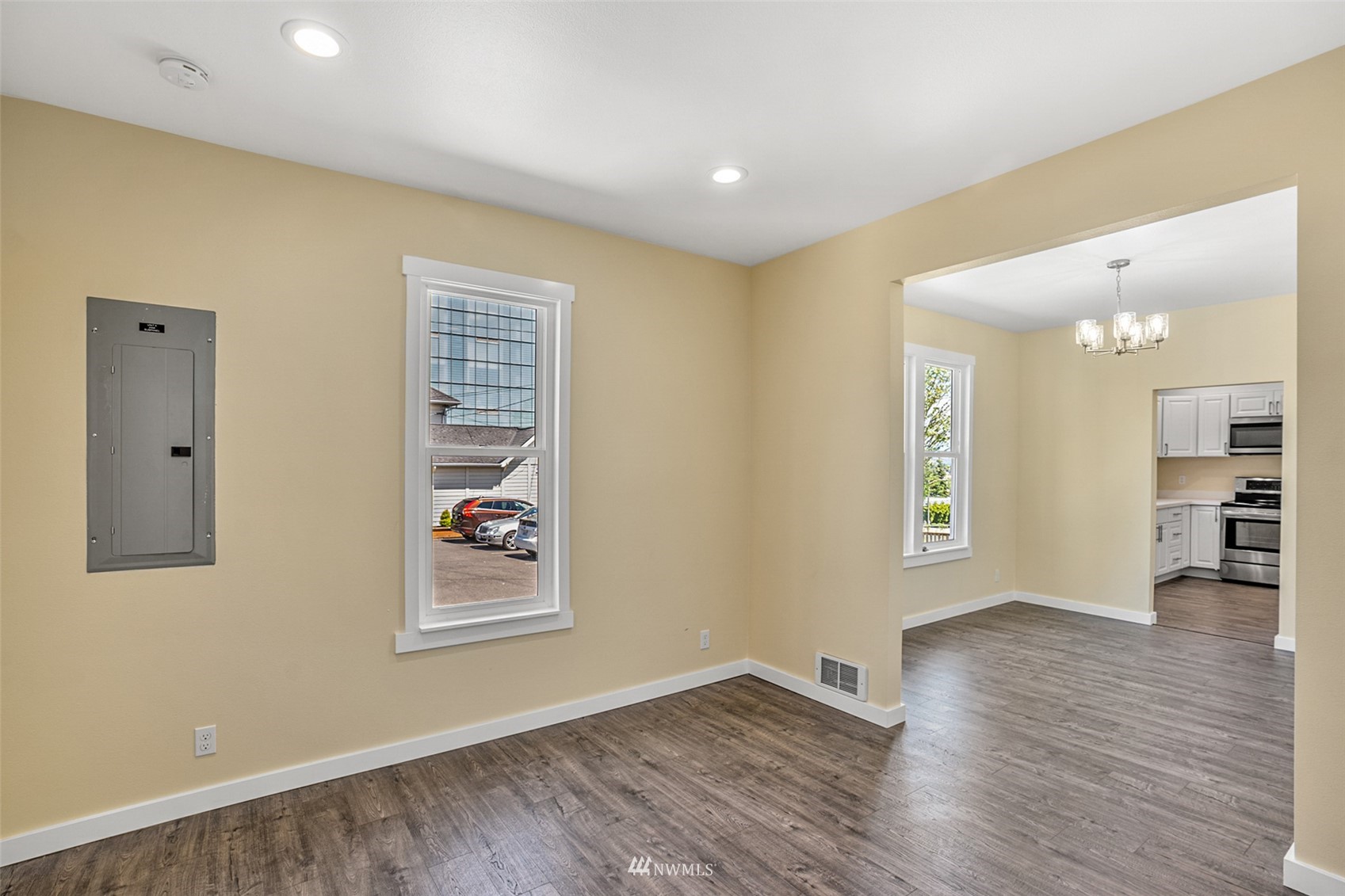 3113 Oakes Avenue Everett, WA 98201 - Photo 5 of 38 a view of an empty room with wooden floor and a window