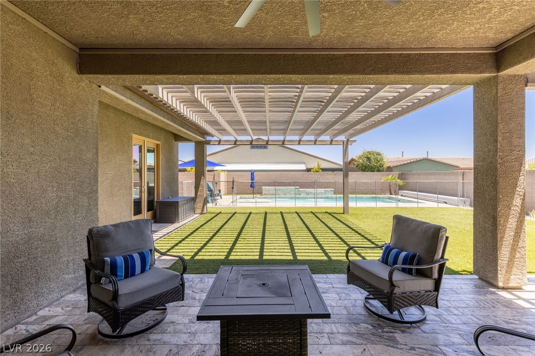 7036 Arabian Ridge Street Las Vegas, NV 89131 - Photo 45 of 64 Spacious covered patio with extended pergolas for additional shade. Large turf areas with plenty of space.
