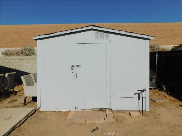 a view of staircase with lots of frames on wall and stairs