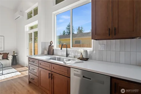 a kitchen with a sink and cabinets
