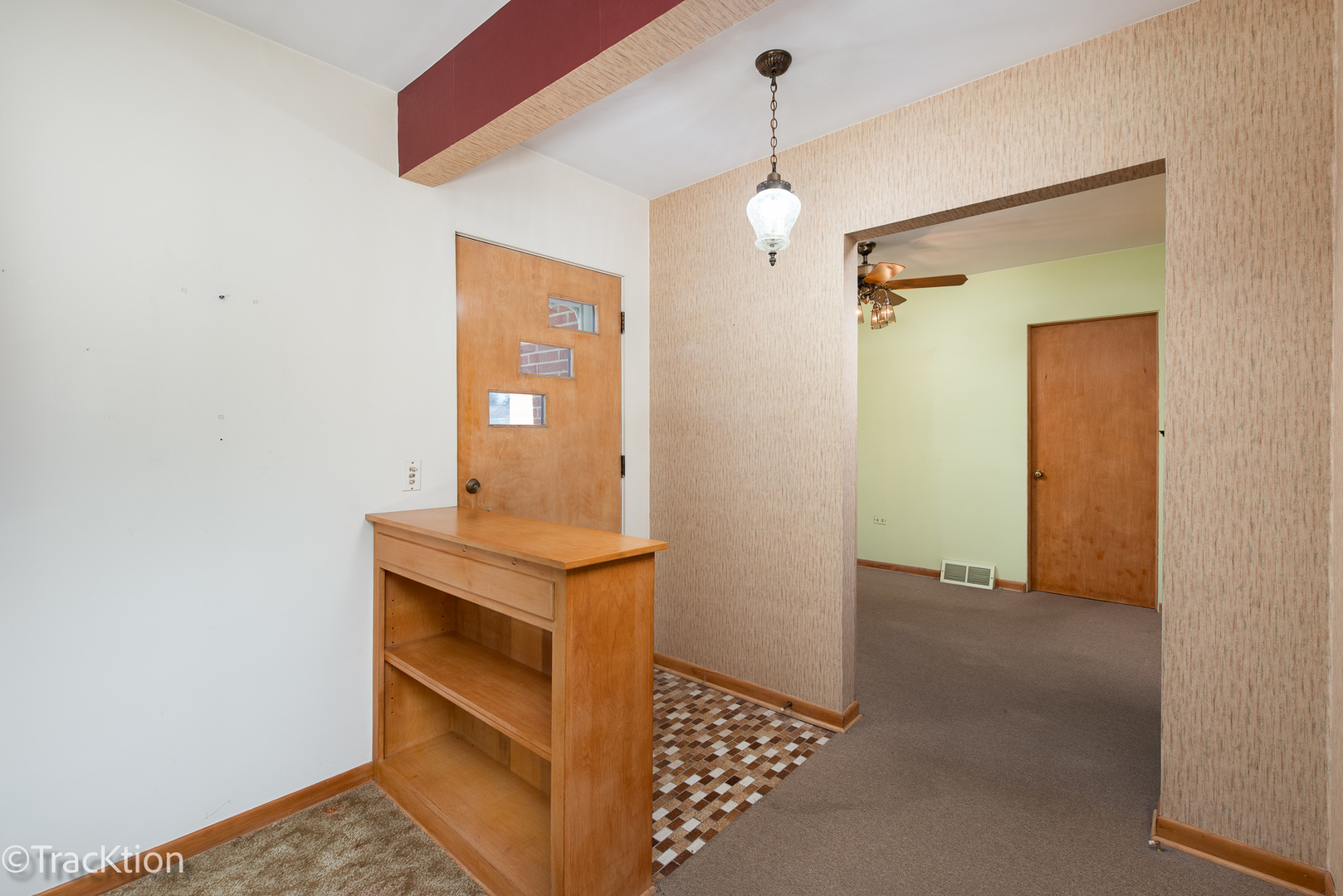 454 Andrus Road Darien, IL 60561 - Photo 4 of 20 a view of hallway with a mirror and a potted plant