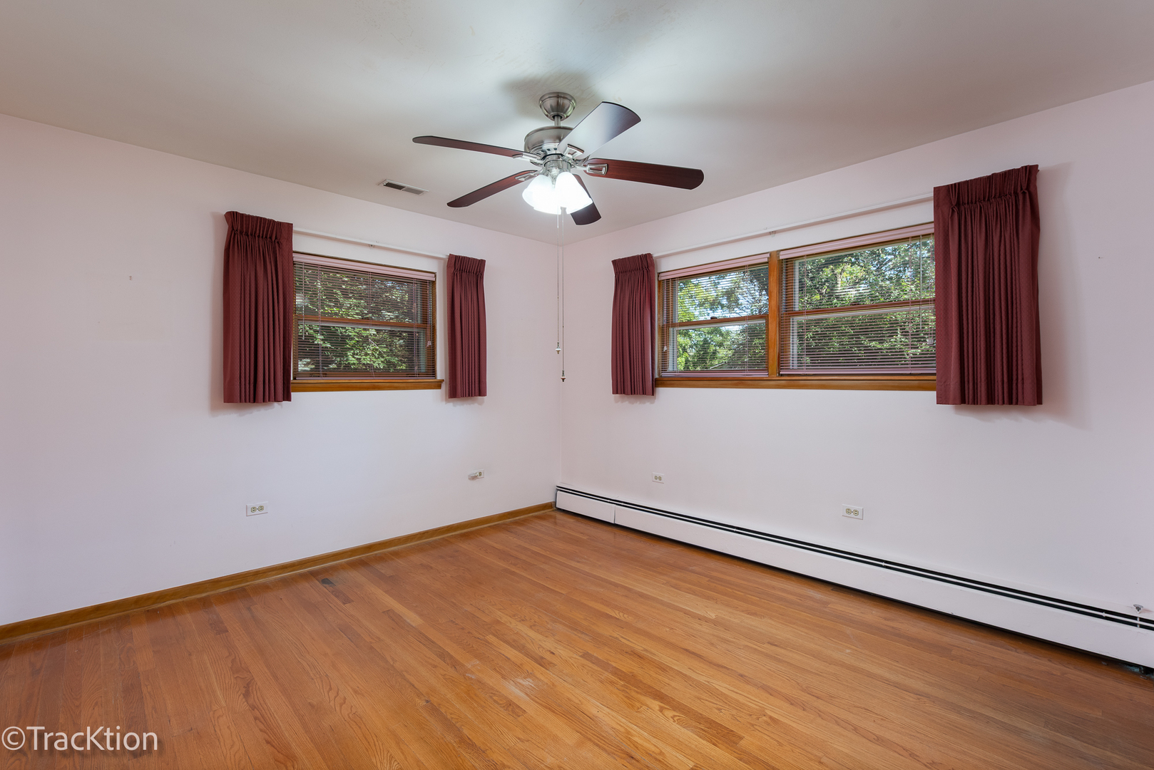 454 Andrus Road Darien, IL 60561 - Photo 8 of 20 a view of empty room with wooden floor and fan