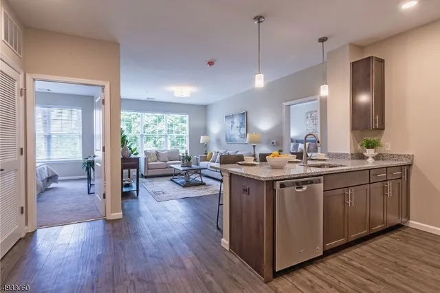 a spacious bathroom with a double vanity sink and a large mirror