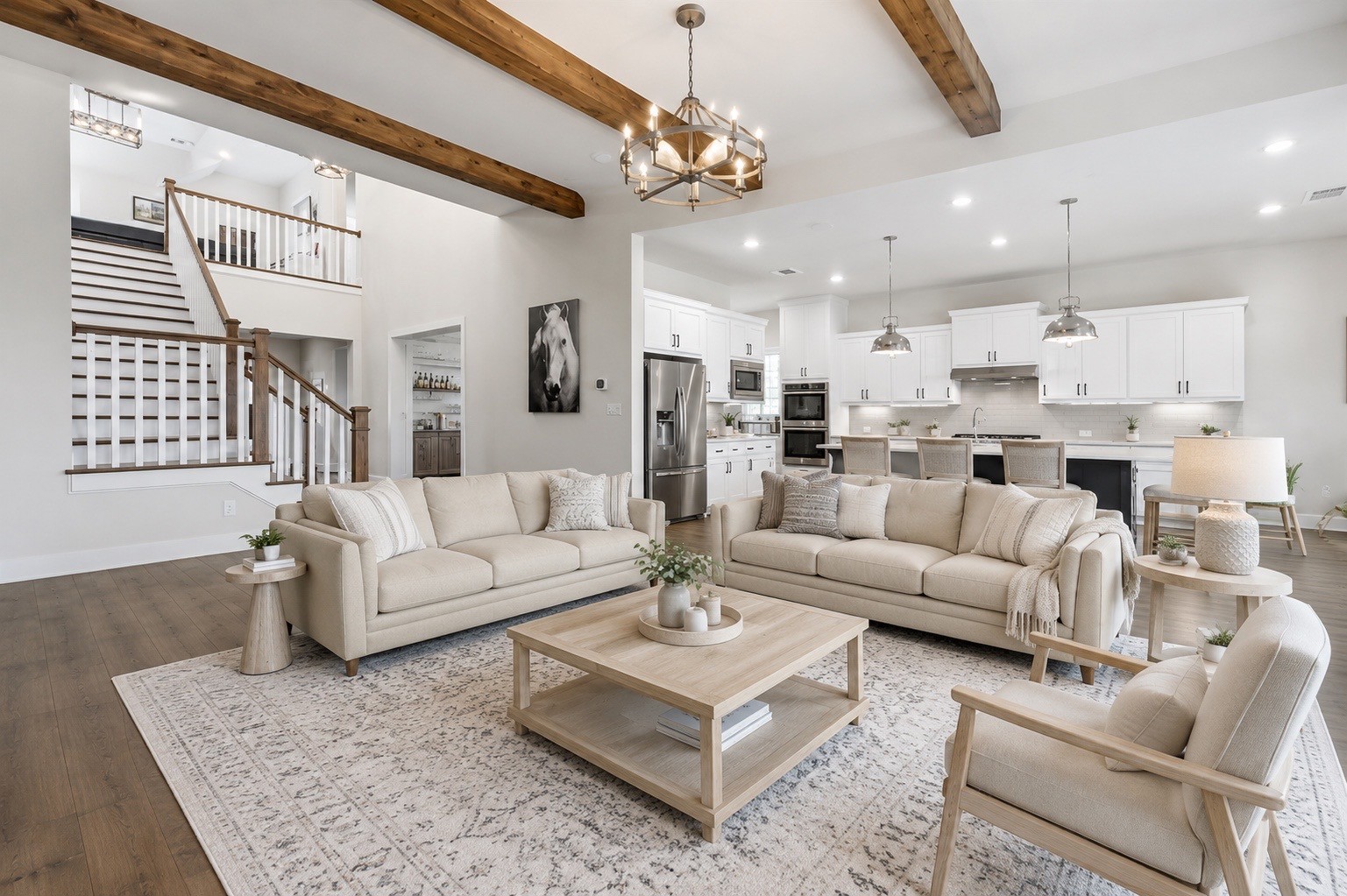 629 Germander Road Leander, TX 78641 - Photo 7 of 38 a living room with furniture kitchen and a chandelier