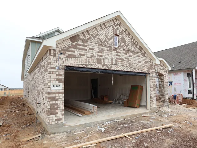 a view of a wooden door and a window