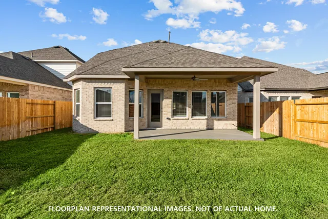 a bathroom with a bathtub shower sink vanity mirror and toilet