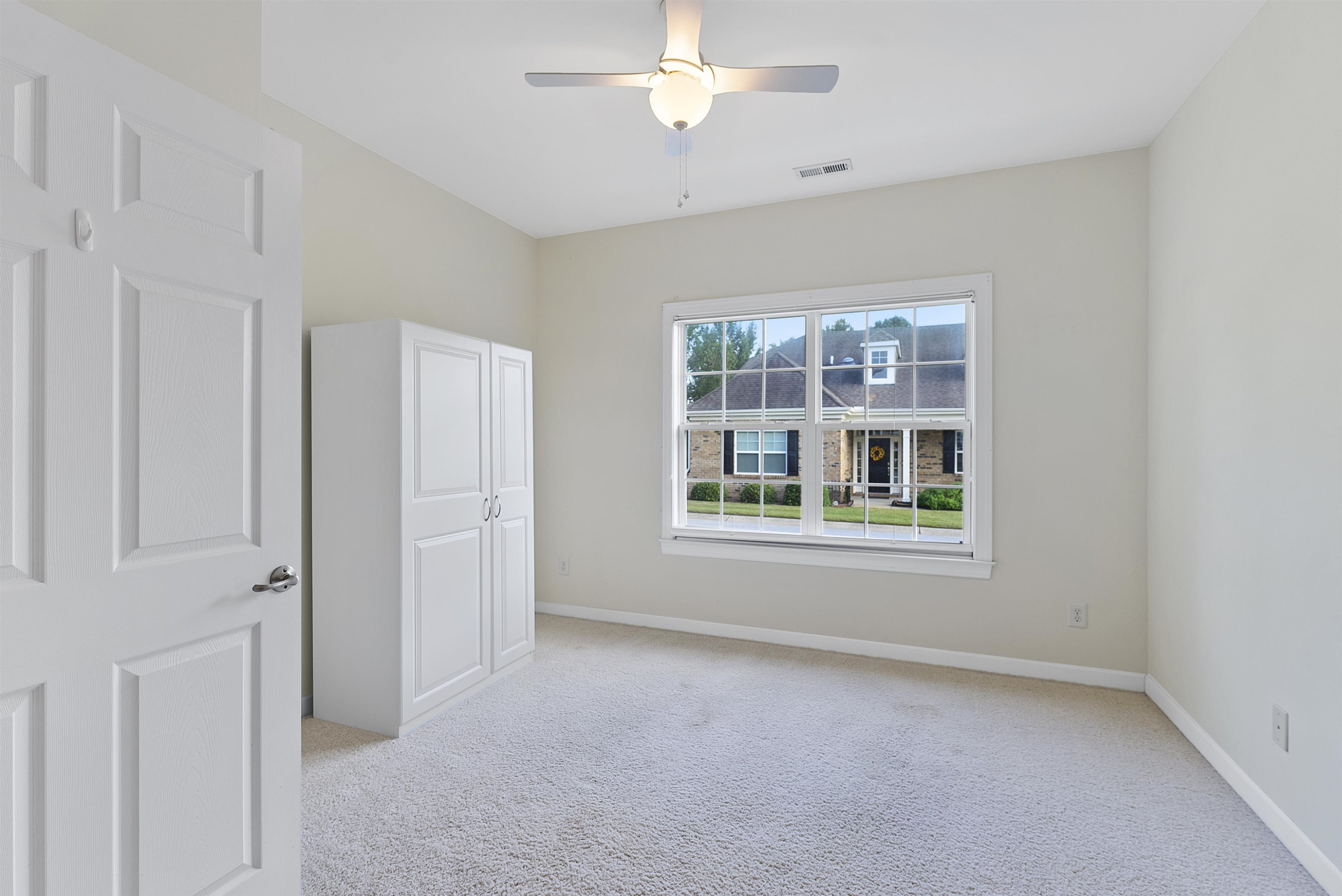 4723 Split Branch Court Raleigh, NC 27604 - Photo 11 of 30 a view of livingroom with window ceiling fan and windows