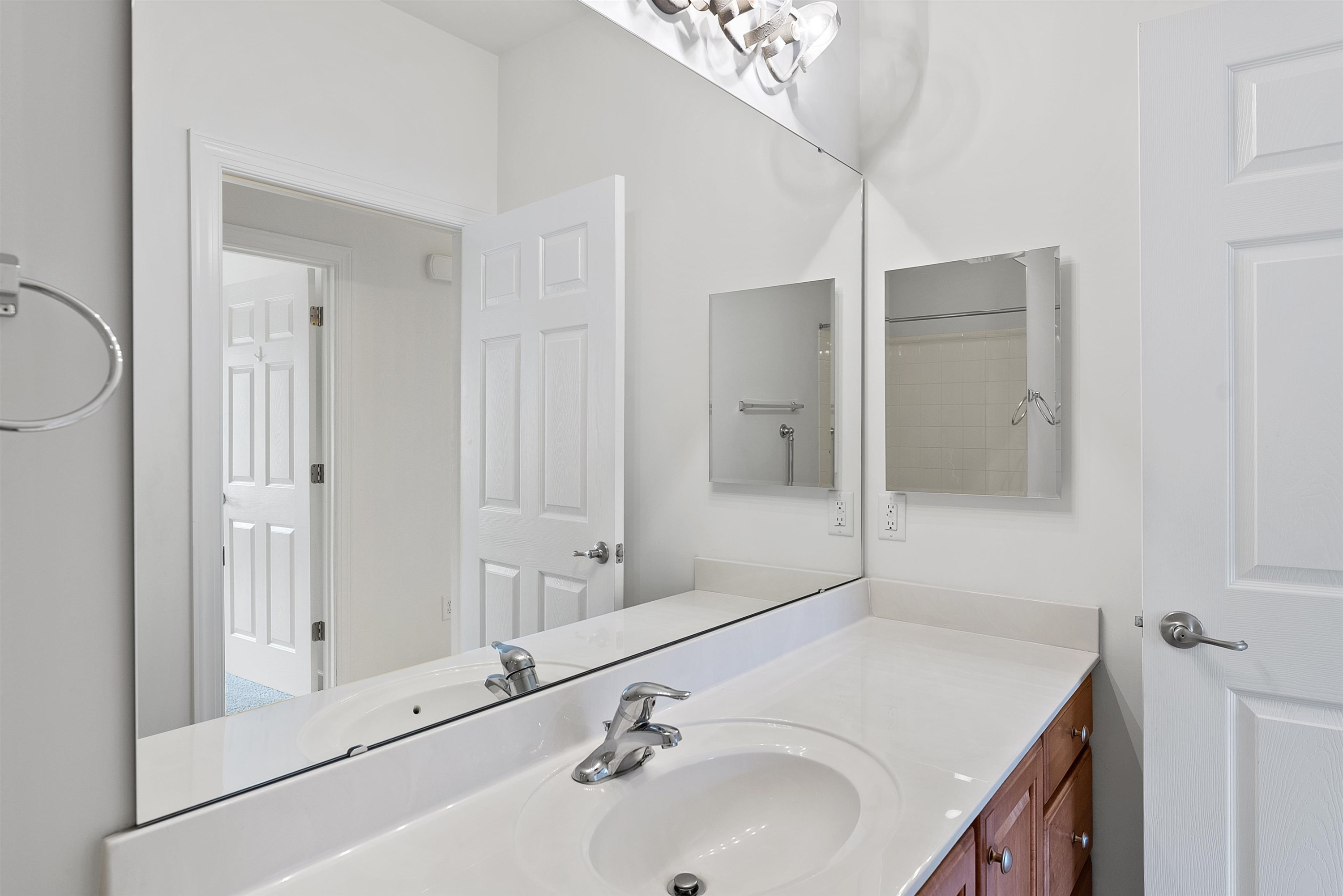 4723 Split Branch Court Raleigh, NC 27604 - Photo 14 of 30 a bathroom with a sink and a mirror
