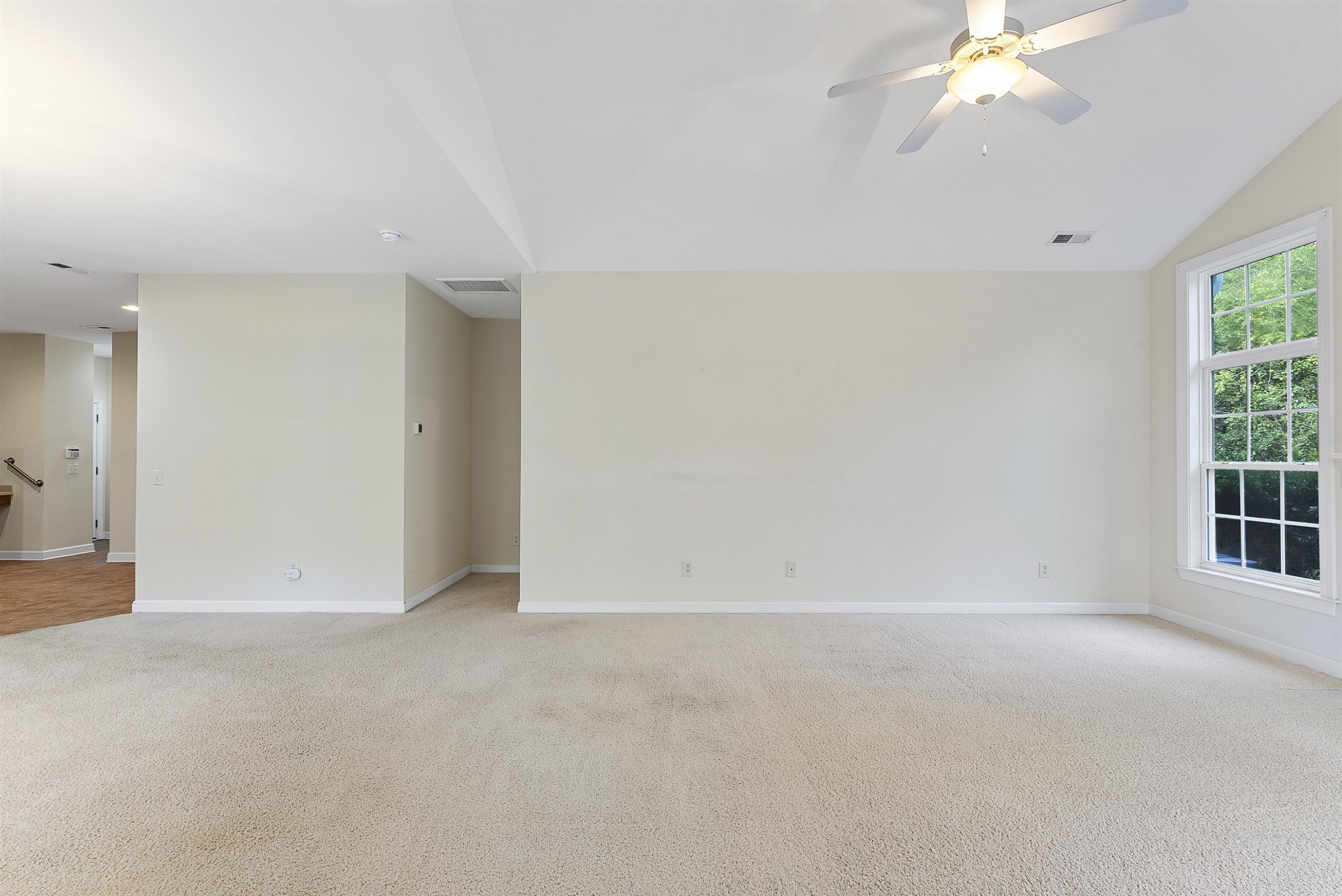 4723 Split Branch Court Raleigh, NC 27604 - Photo 15 of 30 an empty room with a ceiling fan and window
