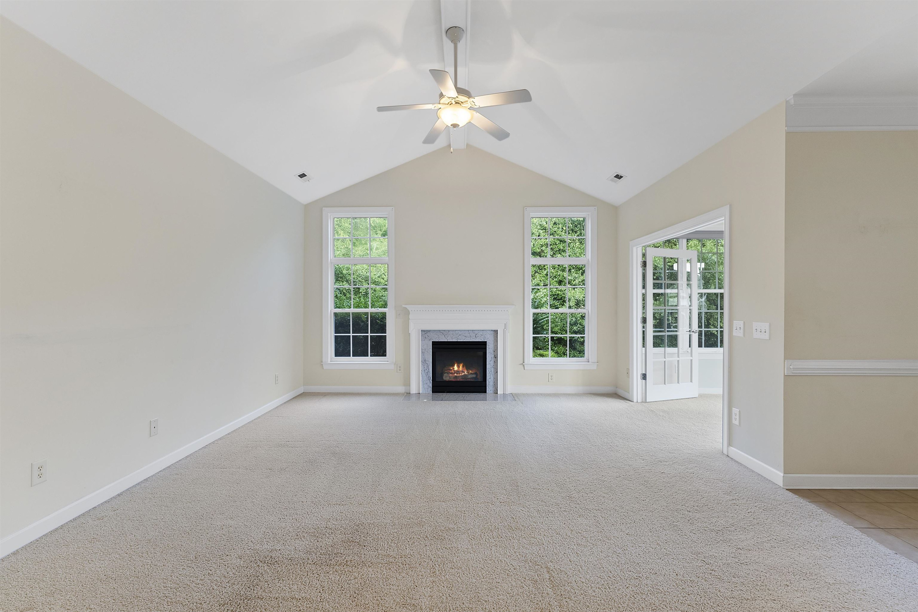 4723 Split Branch Court Raleigh, NC 27604 - Photo 16 of 30 a view of a room with a fireplace and windows
