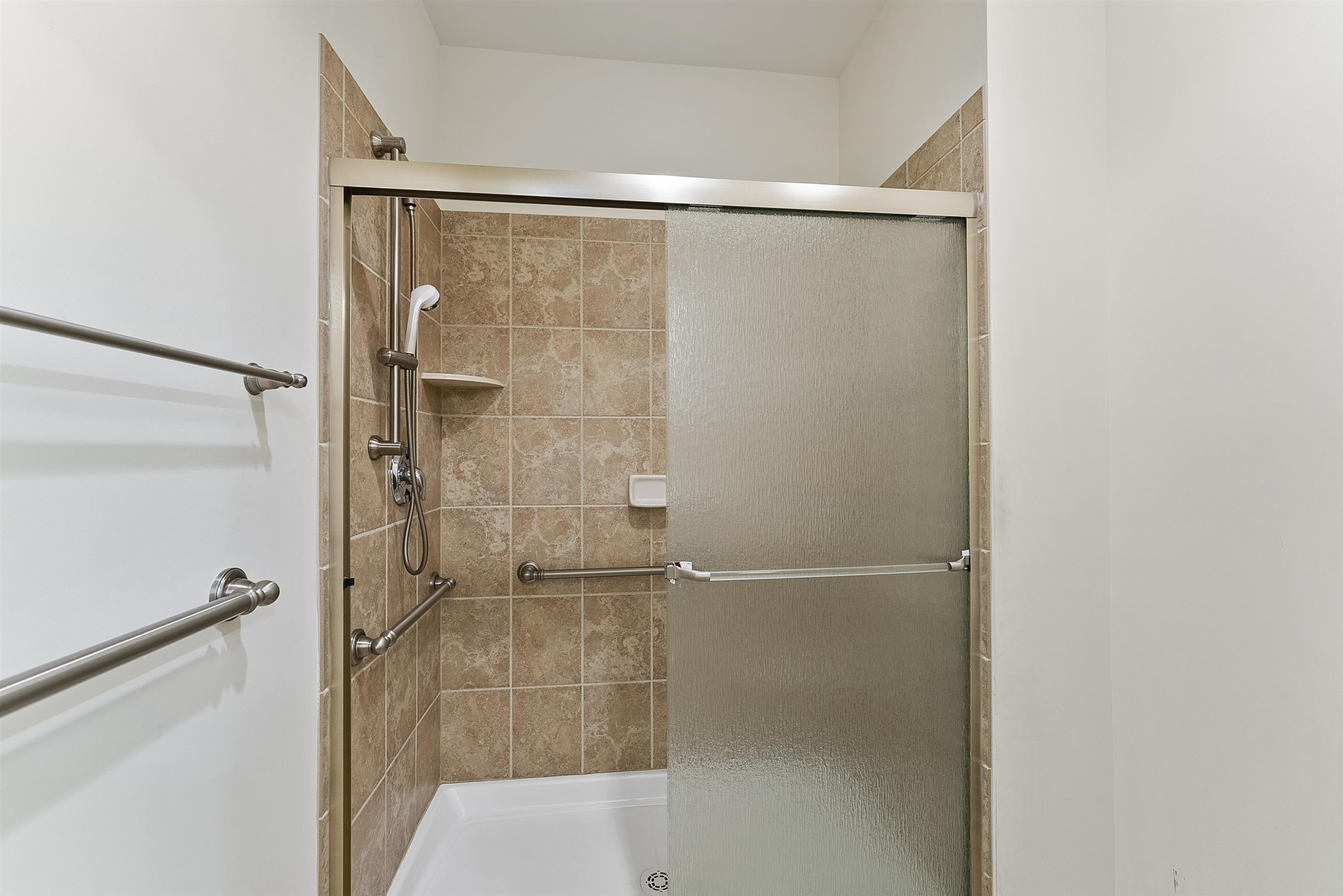 4723 Split Branch Court Raleigh, NC 27604 - Photo 23 of 30 a bathroom with a glass shower door
