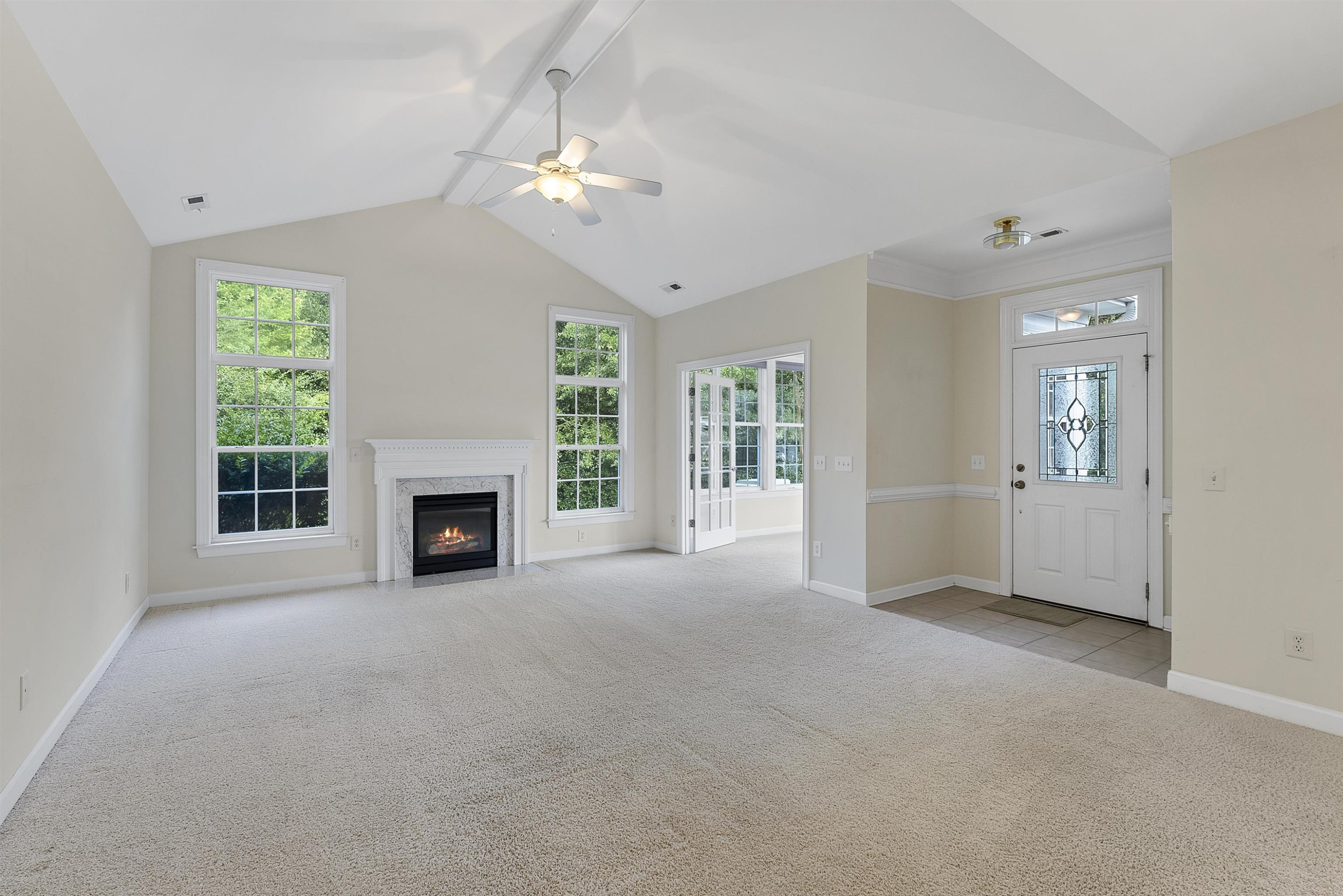 4723 Split Branch Court Raleigh, NC 27604 - Photo 6 of 30 a view of a livingroom with an empty space and a fireplace