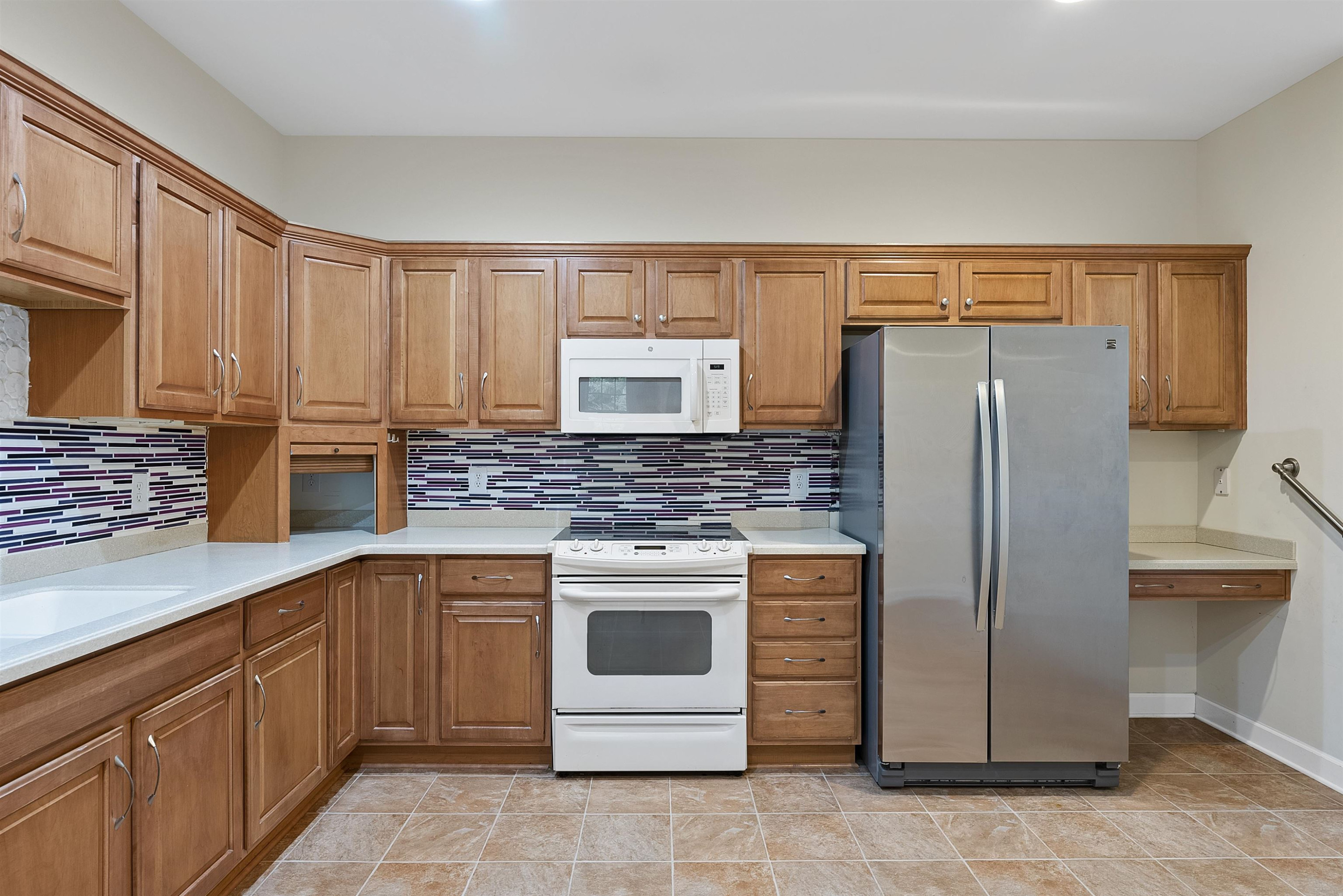 4723 Split Branch Court Raleigh, NC 27604 - Photo 8 of 30 a kitchen with stainless steel appliances granite countertop a refrigerator and a stove top oven