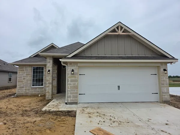 a front view of a house with garage