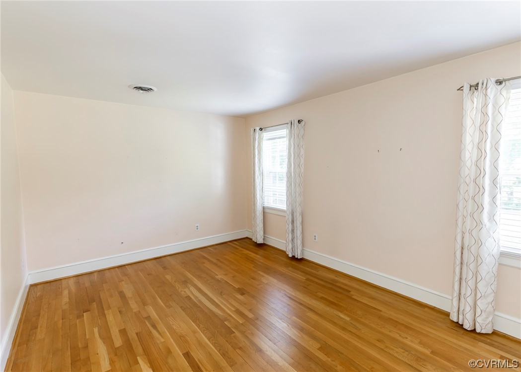 13329 Starcross Road Midlothian, VA 23113 - Photo 33 of 47 an empty room with wooden floor and windows