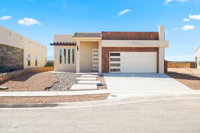 a front view of a house with a garage
