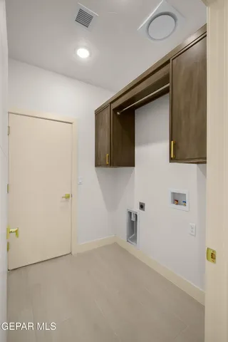 a view of a hallway with a bathroom