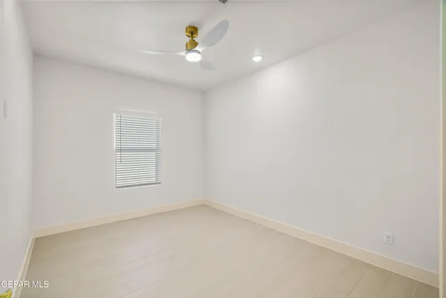 an empty room with a bathroom