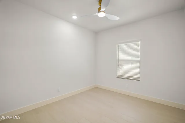 an empty room with a bathroom