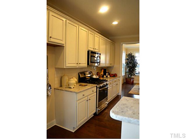 804 Chapanoke Road Raleigh, NC 27603 - Photo 13 of 25 a kitchen with a sink stove and microwave