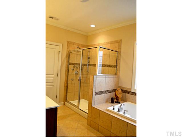 804 Chapanoke Road Raleigh, NC 27603 - Photo 19 of 25 a bathroom with a sink and a shower