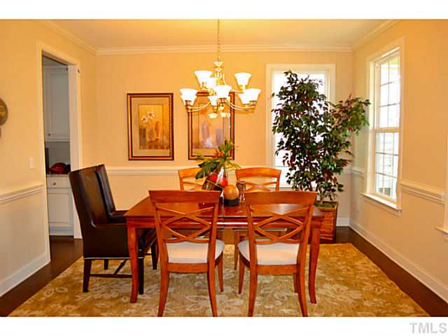 804 Chapanoke Road Raleigh, NC 27603 - Photo 9 of 25 a view of a dining room with furniture and a potted plant