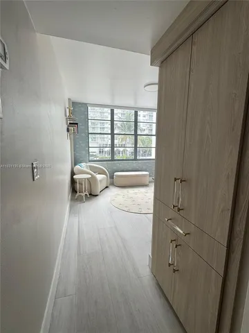 a view of bedroom with a bed and wooden floor