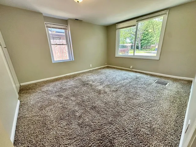 a view of an empty room and window