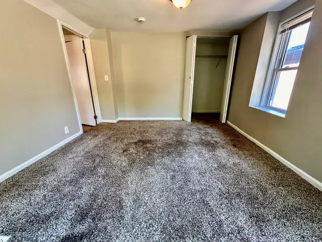 a view of an empty room and window