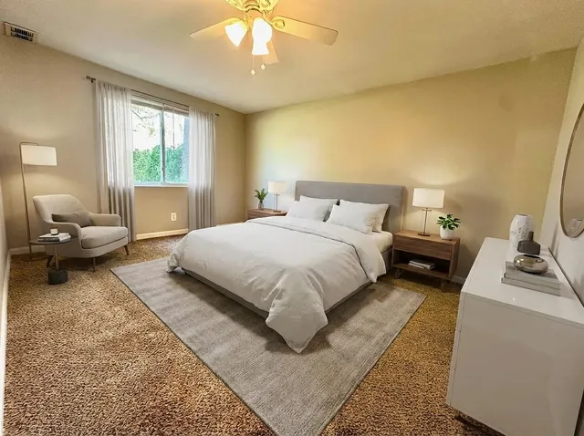 a bedroom with a bed and a couch