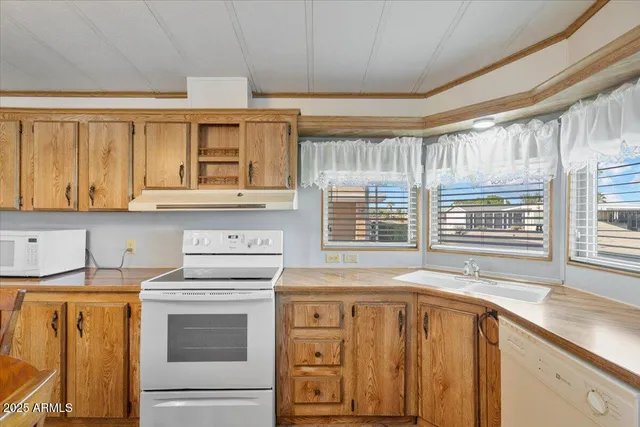 a dining room with furniture a chandelier and wooden floor