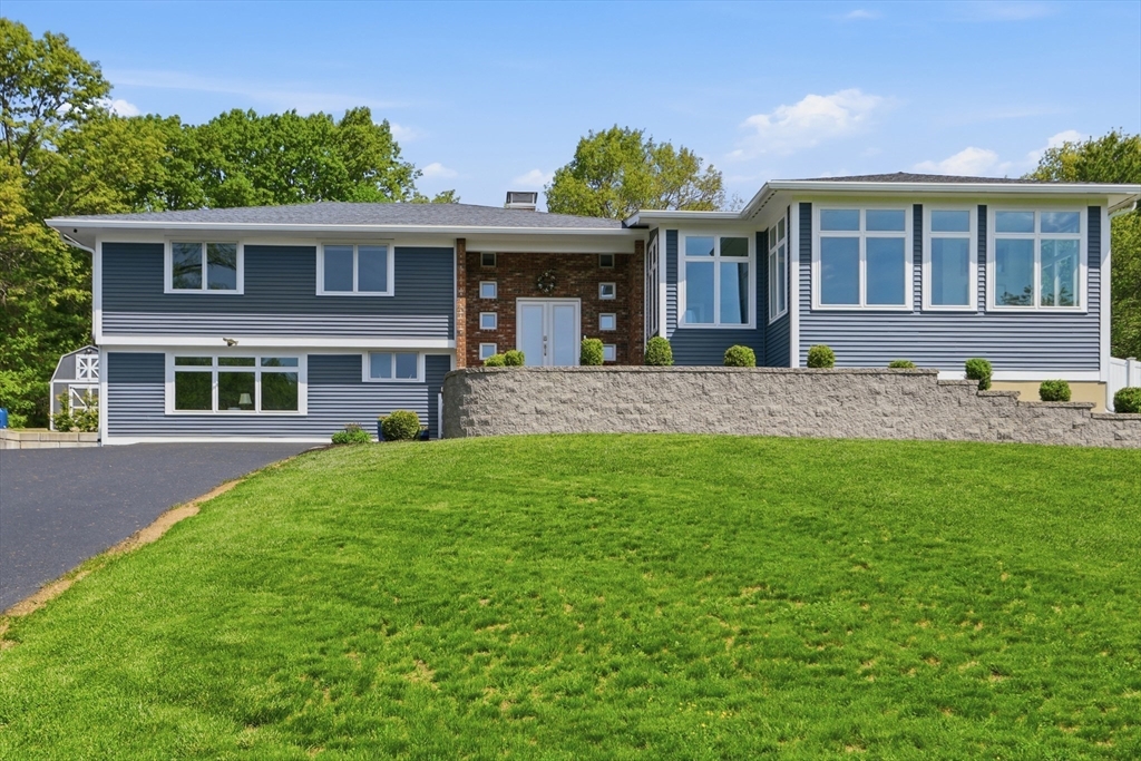 front view of a house with a yard
