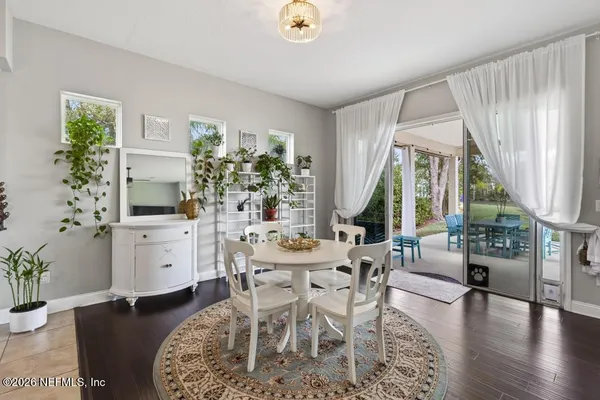a view of a room with a ceiling fan and a window