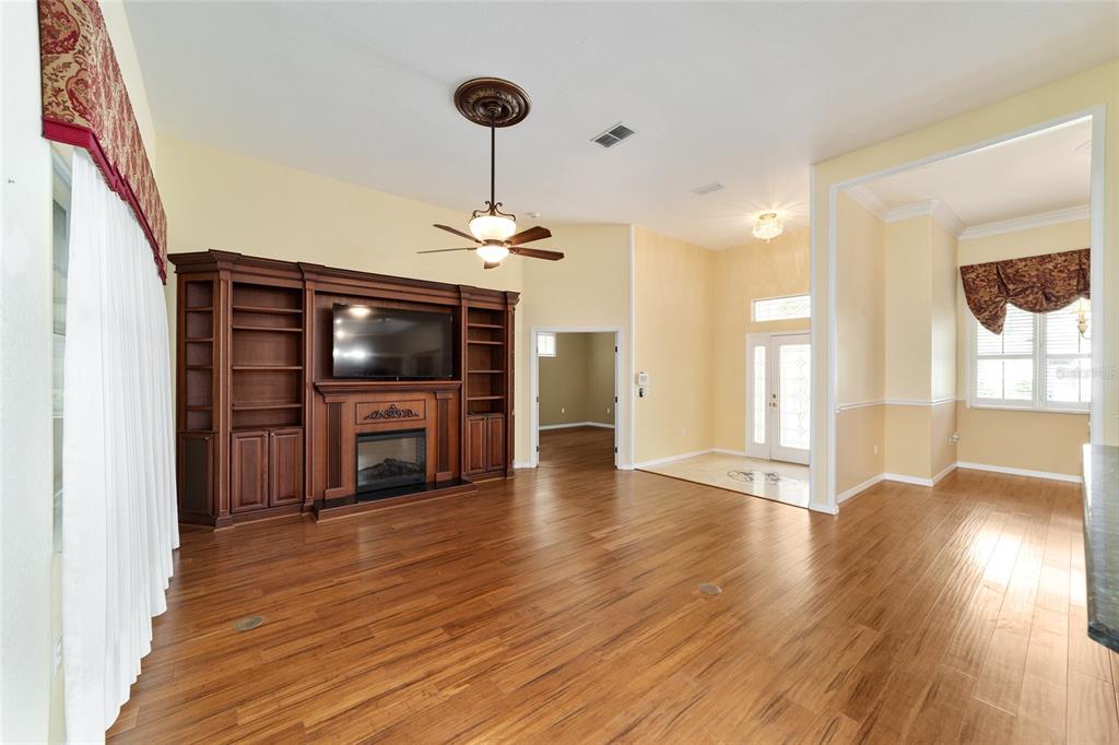 11017 Southwest 71st Terrace Road Ocala, FL 34476 - Photo 11 of 49 a view of a livingroom with wooden floor