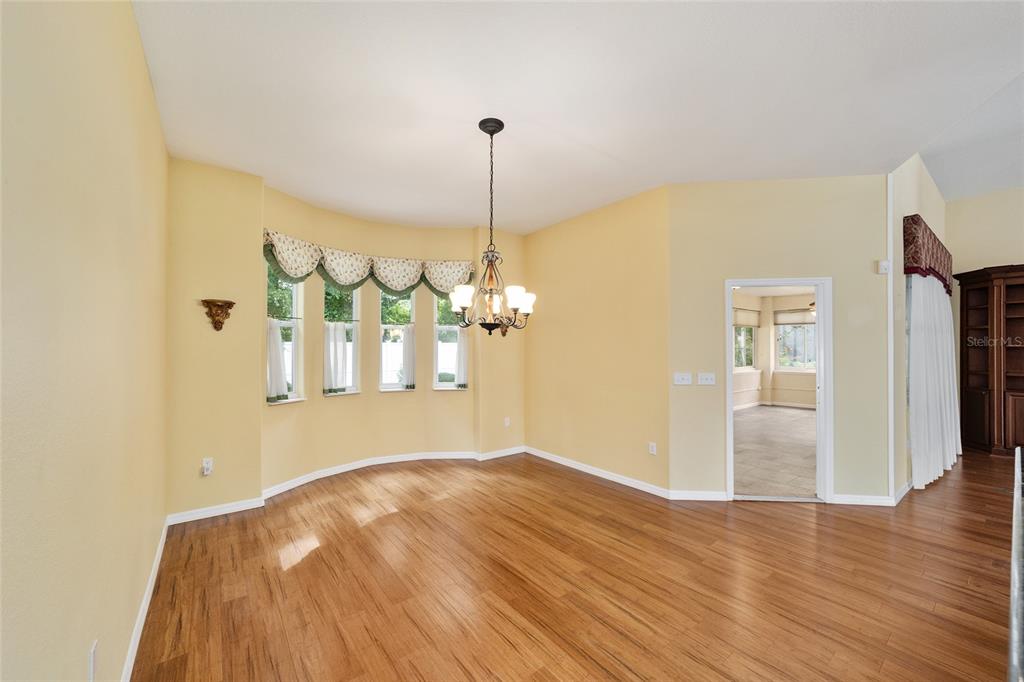 11017 Southwest 71st Terrace Road Ocala, FL 34476 - Photo 22 of 49 a view of a room with window and wooden floor