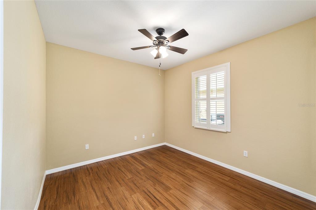11017 Southwest 71st Terrace Road Ocala, FL 34476 - Photo 31 of 49 wooden floor in an empty room with a window
