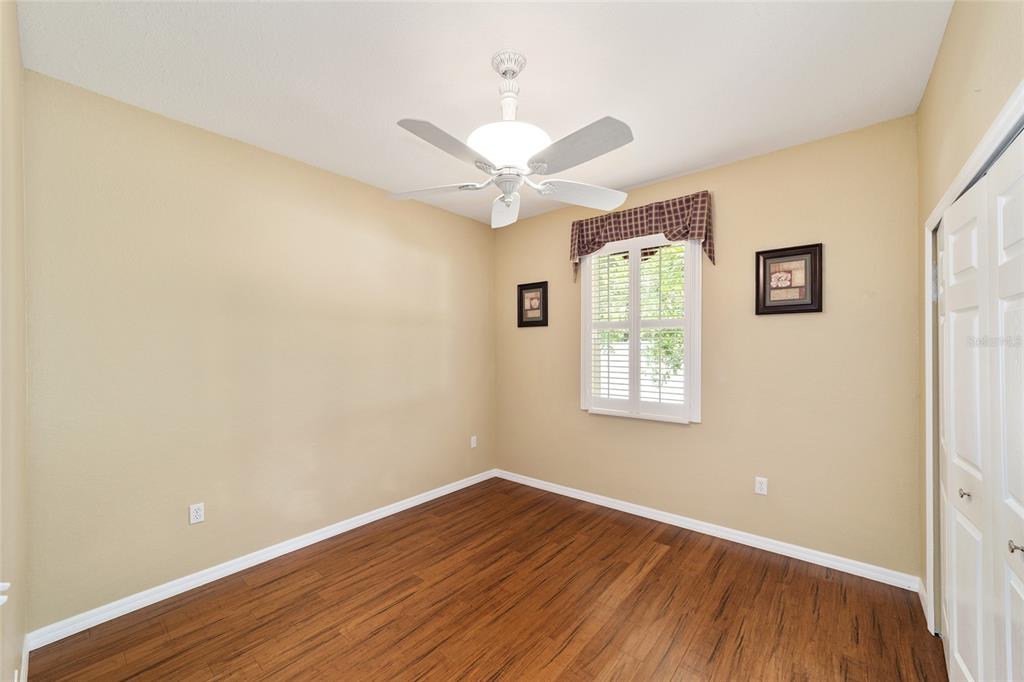 11017 Southwest 71st Terrace Road Ocala, FL 34476 - Photo 34 of 49 a view of an empty room with wooden floor and a window