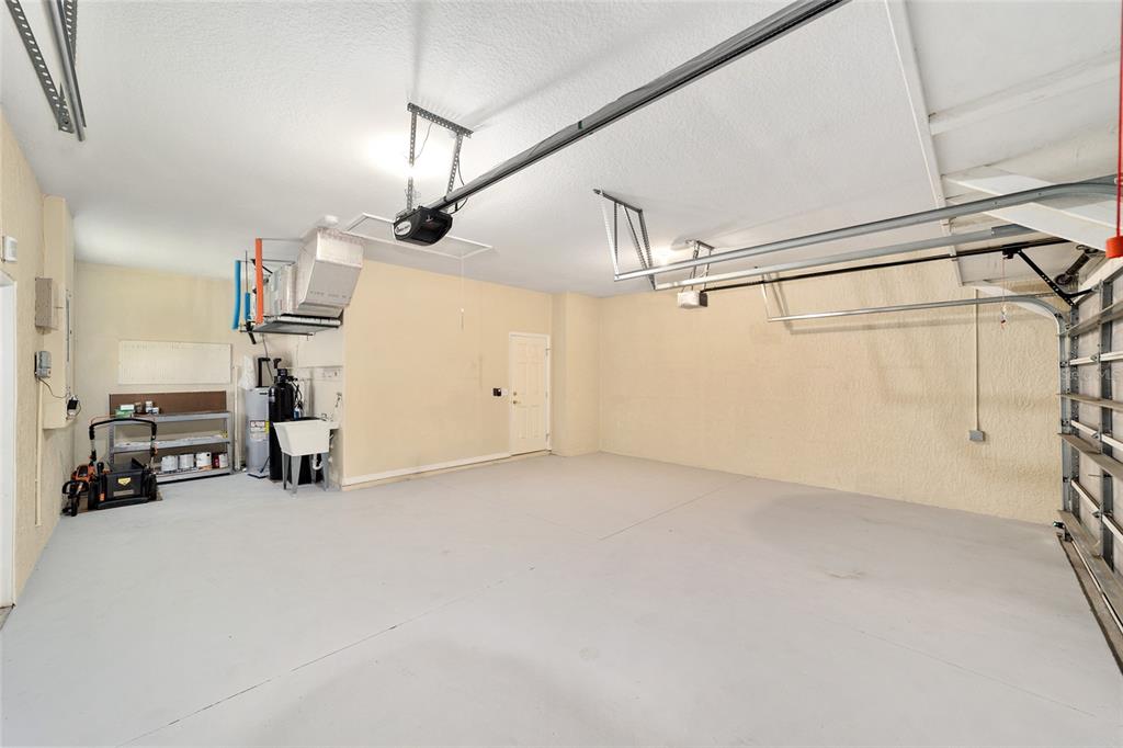 11017 Southwest 71st Terrace Road Ocala, FL 34476 - Photo 37 of 49 a view of a livingroom with furniture and a chandelier