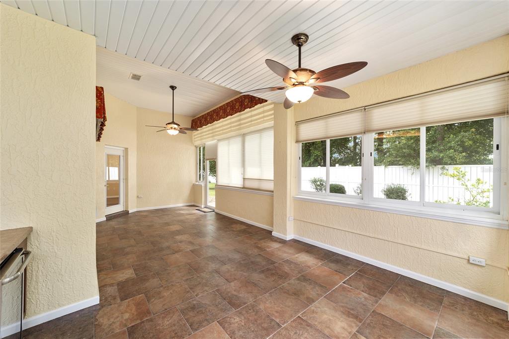 11017 Southwest 71st Terrace Road Ocala, FL 34476 - Photo 38 of 49 a view of a livingroom with a ceiling fan and window