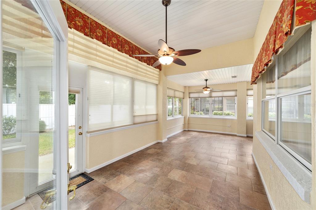 11017 Southwest 71st Terrace Road Ocala, FL 34476 - Photo 39 of 49 a view of a big room with a windows and ceiling fan