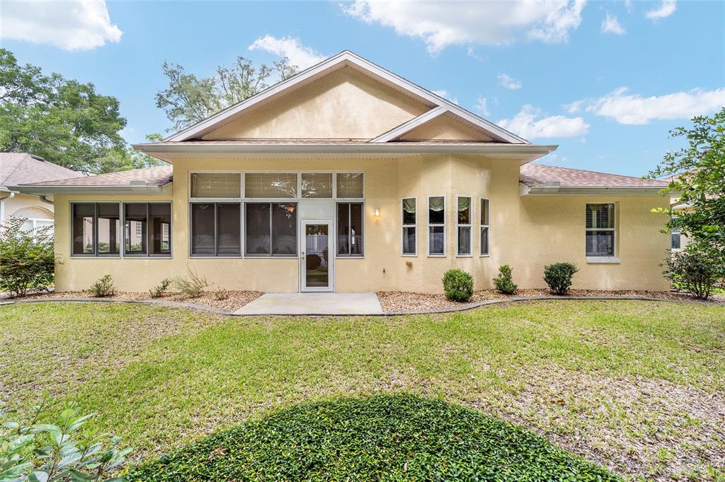 11017 Southwest 71st Terrace Road Ocala, FL 34476 - Photo 42 of 49 front view of a house with a patio