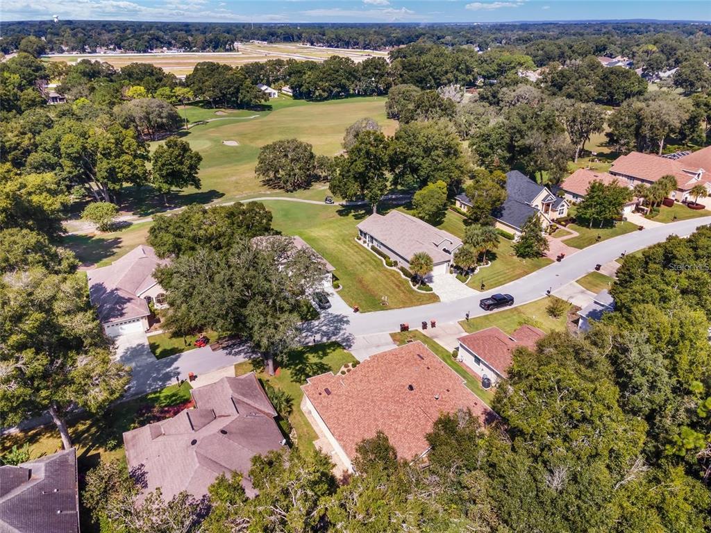11017 Southwest 71st Terrace Road Ocala, FL 34476 - Photo 47 of 49 an aerial view of residential house with outdoor space and lake view