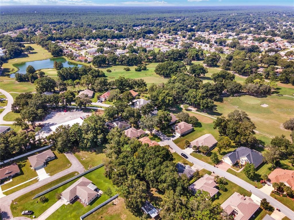11017 Southwest 71st Terrace Road Ocala, FL 34476 - Photo 48 of 49 an aerial view of residential houses with outdoor space