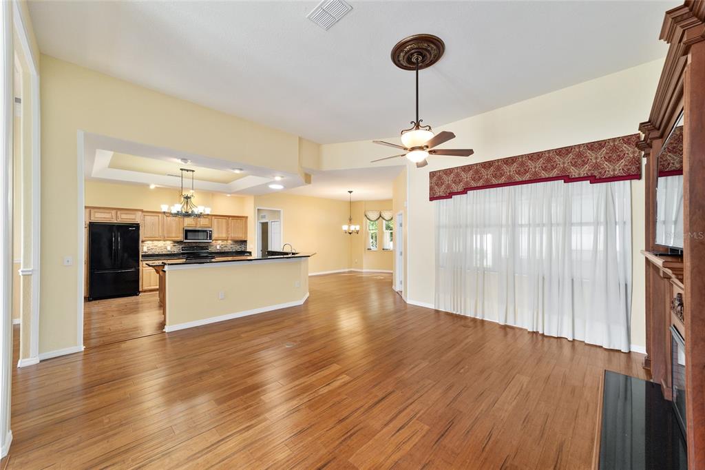 11017 Southwest 71st Terrace Road Ocala, FL 34476 - Photo 10 of 49 a view of a kitchen with cabinets appliances and a wooden floor