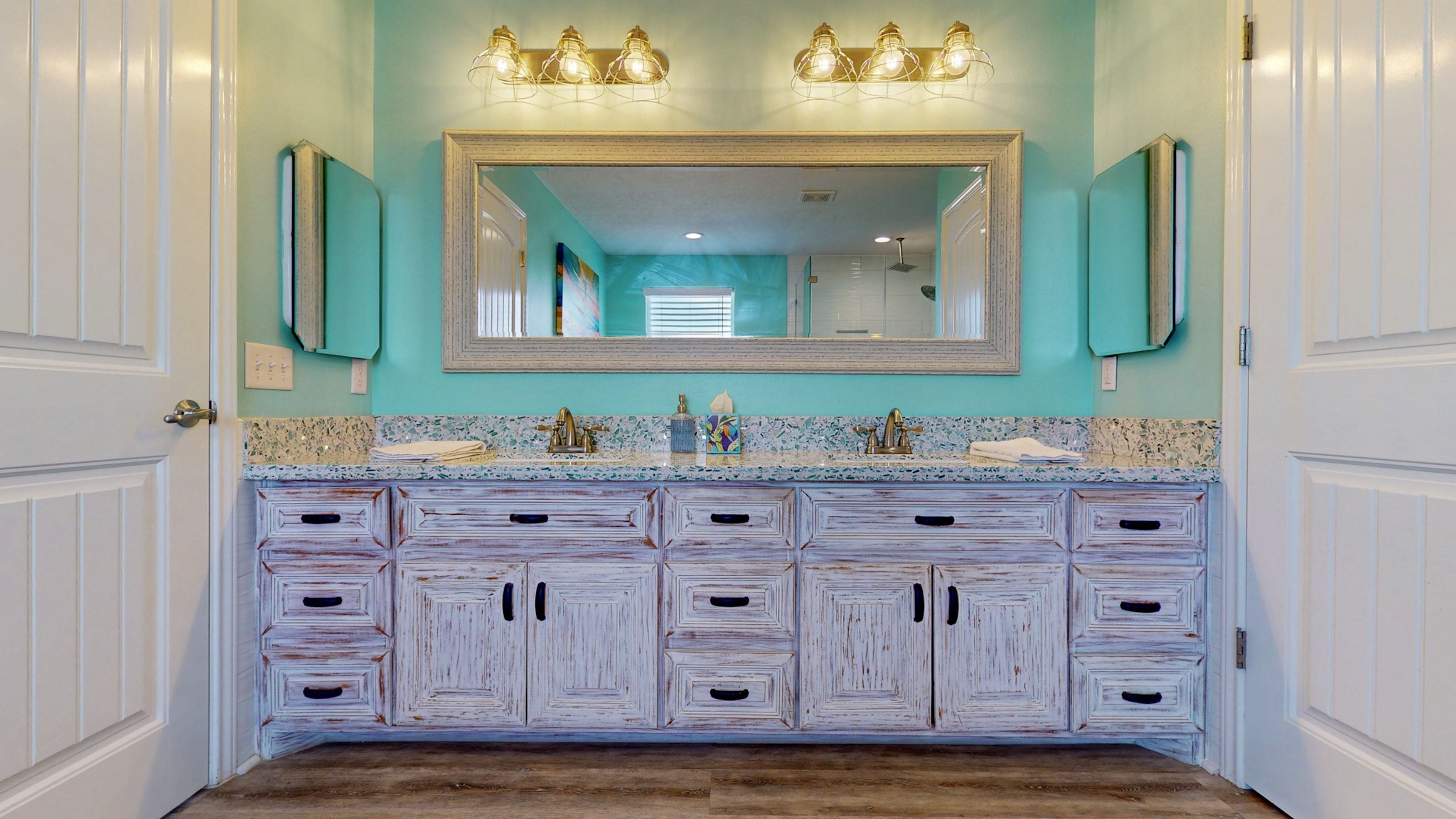 1822 Redfish Lane Crystal Beach, TX 77650 - Photo 14 of 28 a bathroom with a granite countertop sink vanity and mirror