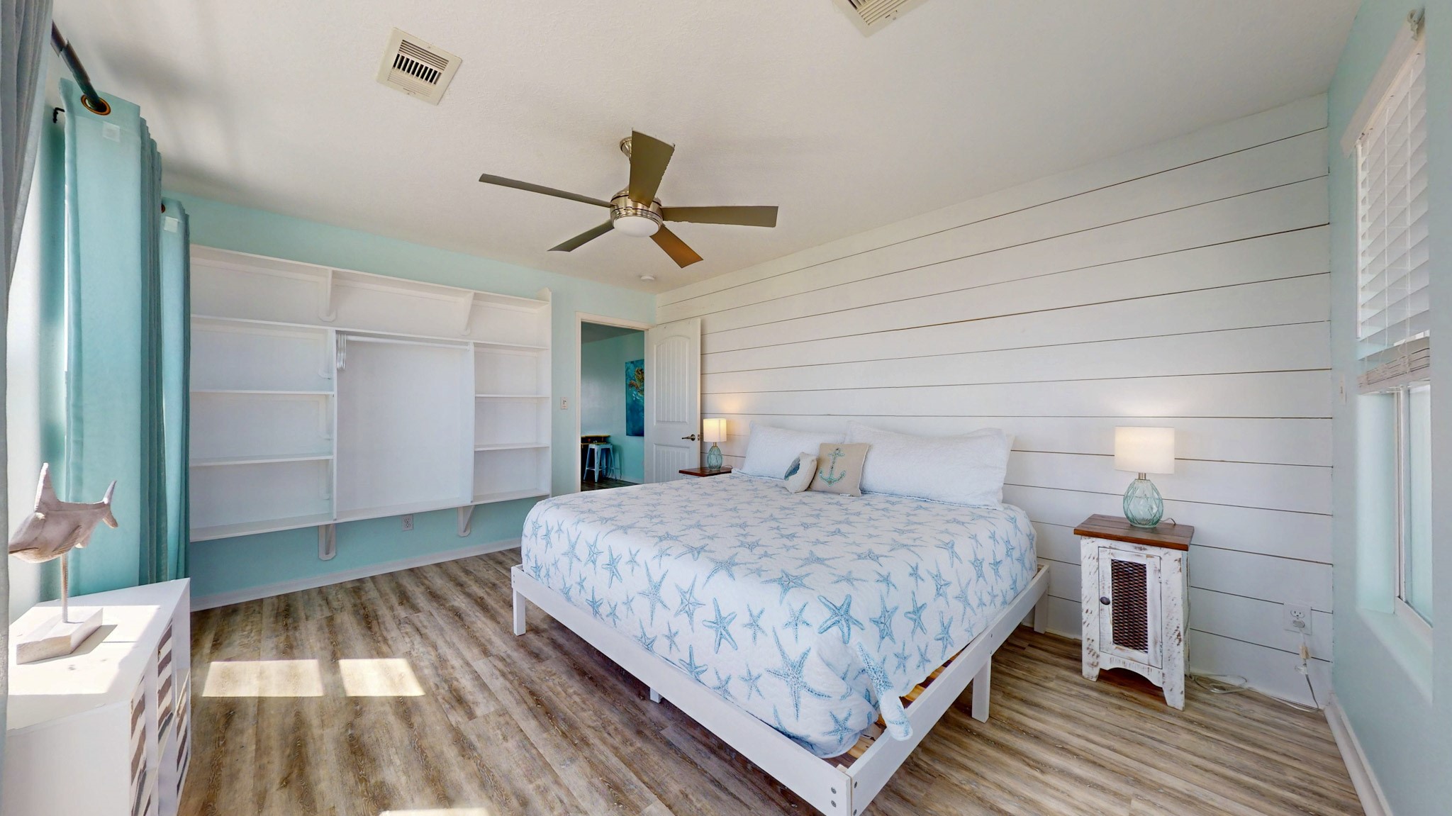1822 Redfish Lane Crystal Beach, TX 77650 - Photo 16 of 28 a bedroom with a bed and a mirror