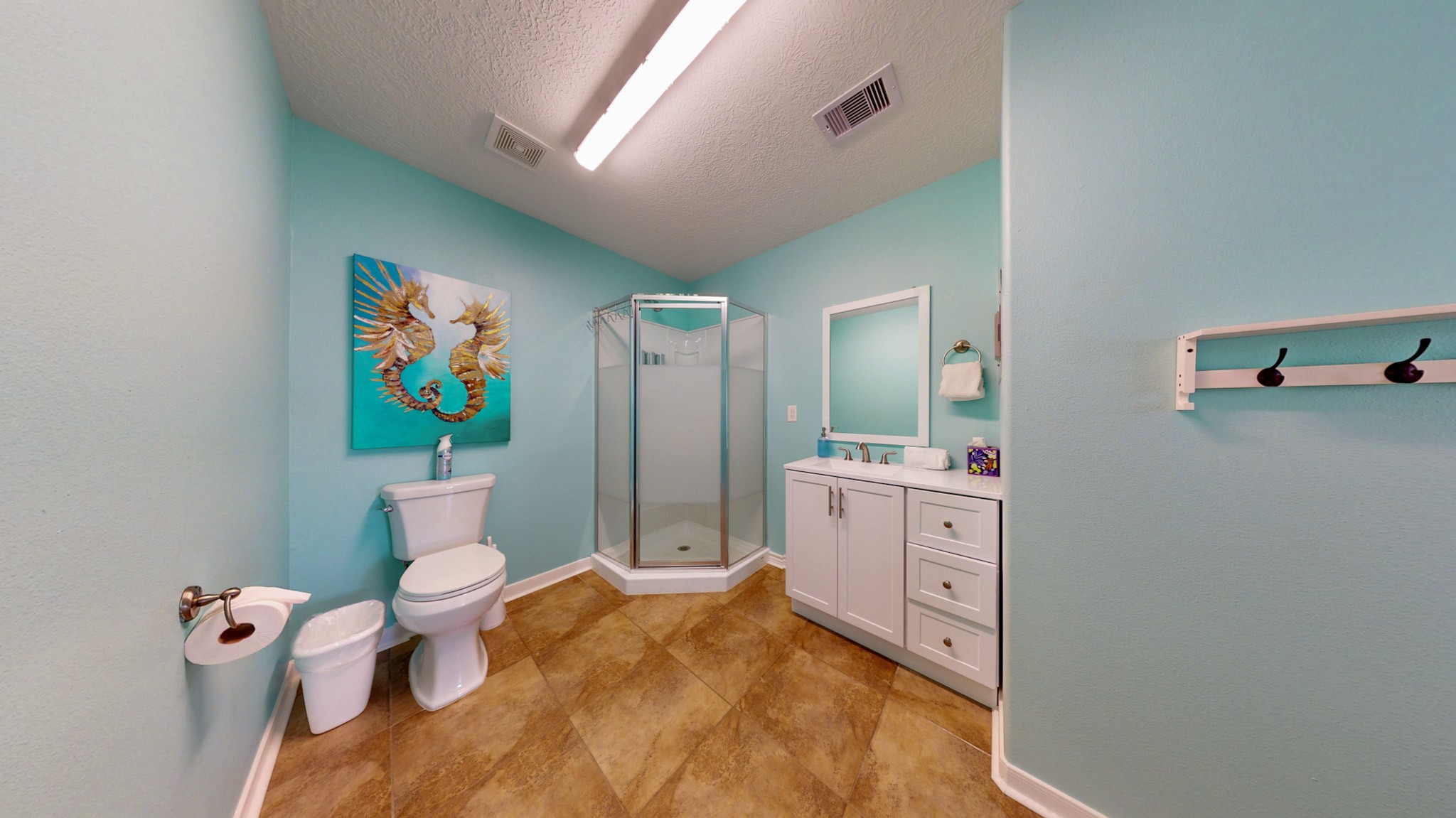1822 Redfish Lane Crystal Beach, TX 77650 - Photo 17 of 28 a bathroom with a sink mirror vanity and toilet