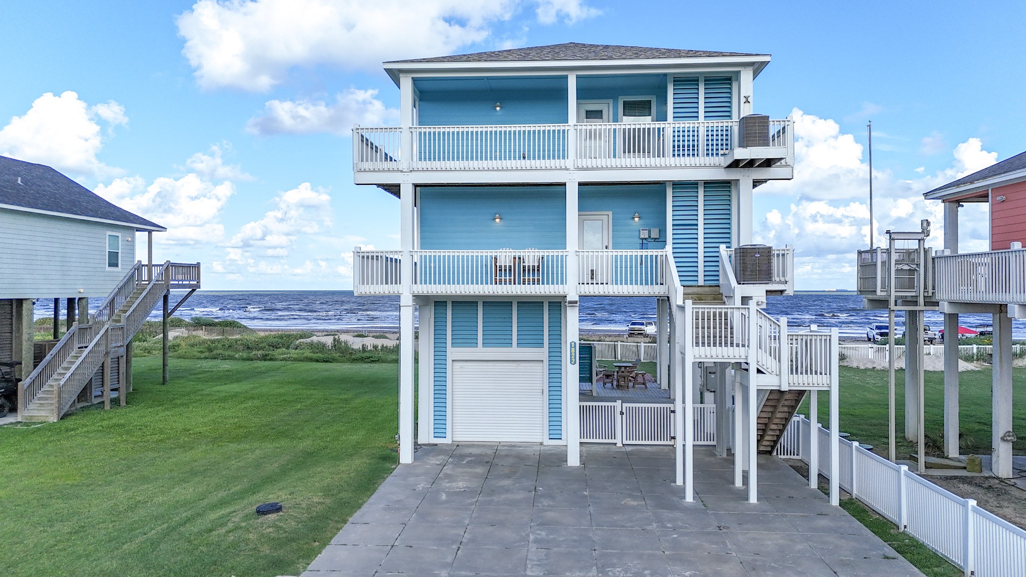 1822 Redfish Lane Crystal Beach, TX 77650 - Photo 3 of 28 a view of a house with a yard and a garden