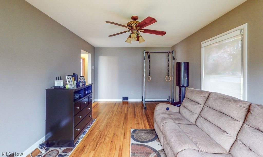 770 Yerrick Road Akron, OH 44312 - Photo 5 of 28 Living room featuring ceiling fan and light wood-type flooring