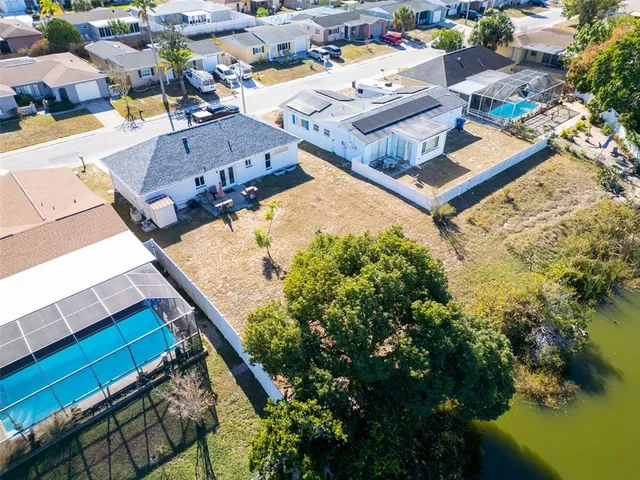 an aerial view of a house with a ocean view
